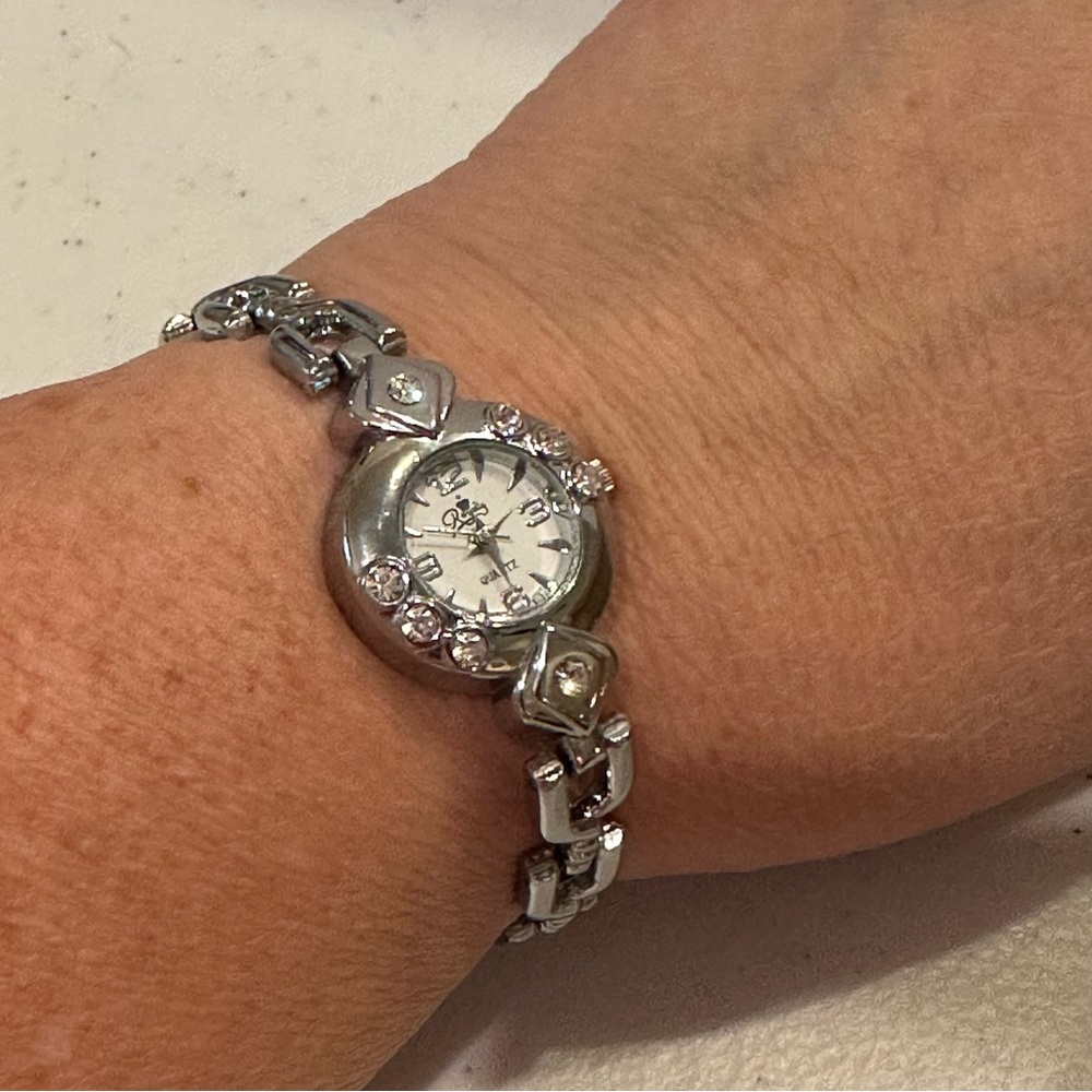 Royalty Watch, silver tone bracelet style w/ clear rhinestones- new battery !